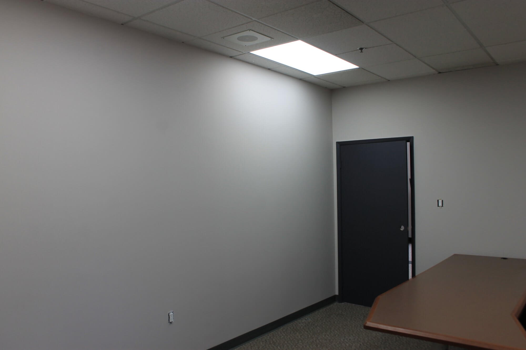 Finished office with suspended ceiling and door